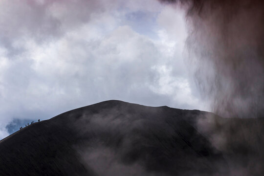 A group of people at Mt. Bromo in morning mist ,East Java, Indonesia.