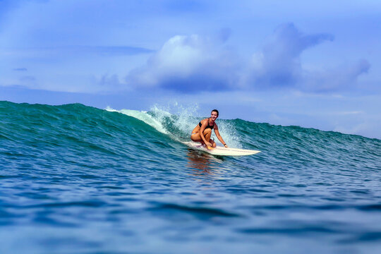 Young woman surfing