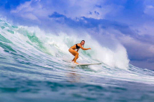 Young woman surfing