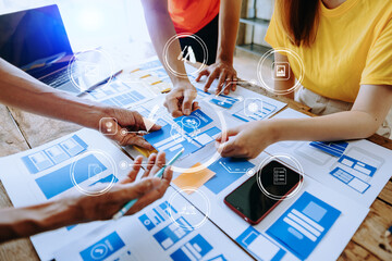  UX developer and ui designer brainstorming about mobile app interface wireframe design with...