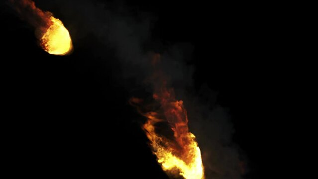 3d Animation of fireballs isolated on black
