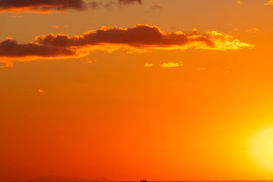 Sunset background photo. Partly cloudy sky at sunset.