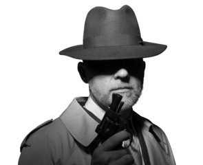 Detective holding a gun in the dark