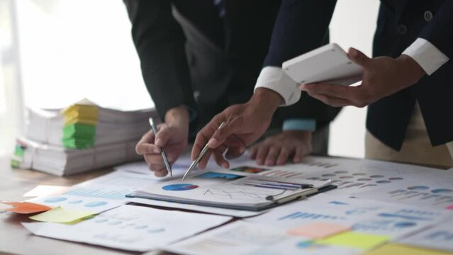 Business advisor meeting to analyze and discuss the situation on the financial report in the meeting room, Financial advisor and accounting concept.