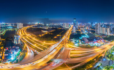Fototapeta na wymiar Panorama view of Hanoi city from above in twighlight blue hour. Urban city background in Asia