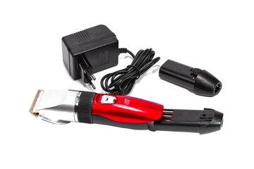 Hair clipper, two replaceable batteries, charger on white background