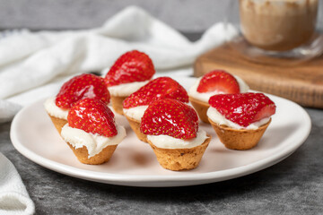Strawberry tartlet. Delicious tartlet dessert on plate. close up