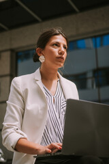 Close up of business woman working on her laptop