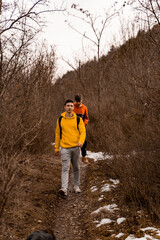 Walking and smiling while having a fun time together in the forest
