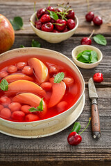 Sweet and healthy fruit soup made of summer fruits.