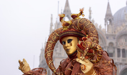 a disturbing joker at carnival in front of the cathedral of San Marco