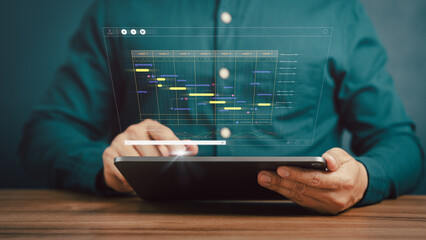 Man working with technology computer in business analytics and data management system to make report with KPI and metrics connected to database. Corporate strategy for operations, planing, marketing.