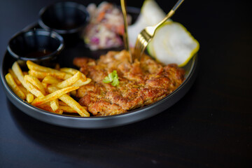 Grilled chicken breast, French fries and vegetabe stock photo
