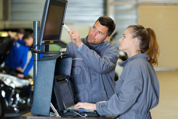 man and woman mechanics atwork