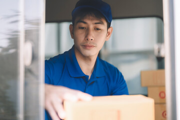 Asian delivery man work in truck for checking the product in the truck, concept ecommerce.