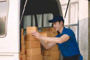 Asian delivery man, delivery men unloading cardboard boxes from truck.