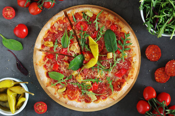 Pizza diavolo flat lay with pepper