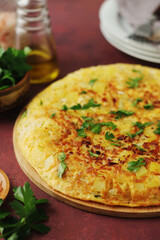 Frittata, traditional egg and potato omelette, Italian dish