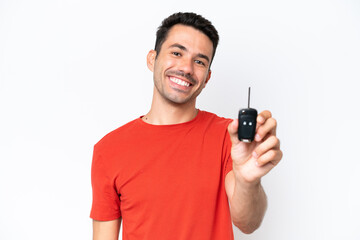 Young handsome man holding car keys over isolated white background with happy expression