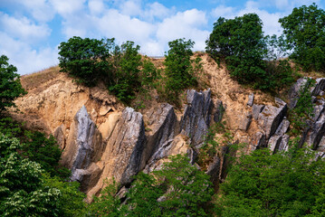 Amazing geologichal park with cliffs and lookout tower in aerial view. This is in Baranya count south Hungary. This place it was a stone mine in the past.