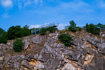 Fototapeta na wymiar Amazing geologichal park with cliffs and lookout tower in aerial view. This is in Baranya count south Hungary. This place it was a stone mine in the past.
