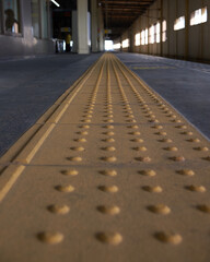 Yellow guidance block for the visually impaired in the platform of the station in Japan