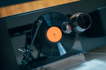 High angle view of glass of wine swirling on the turntable