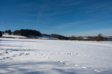 Winter landscape with lots of snow and blue sky