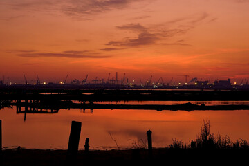 Fototapeta premium sunset with the harbor in background