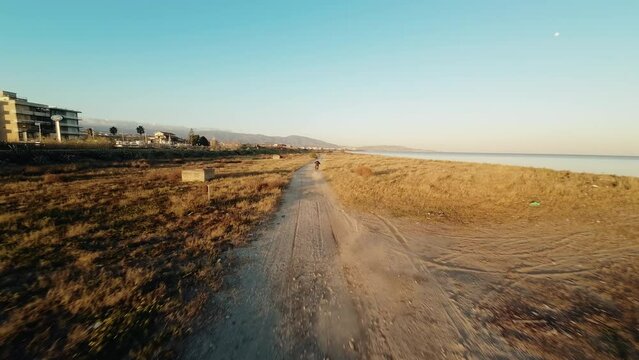 Motocross rider on dirty road 