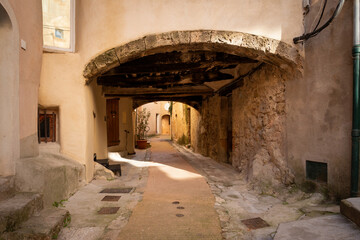 A street with an arch in Cotignac in Provence, a region of southern France