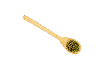Green bean seeds in a wooden spoon isolated