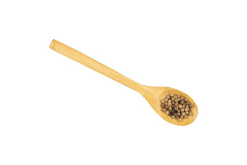 Pepper seeds in a wooden spoon isolated