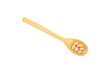 Peanut seeds in a wooden spoon isolated