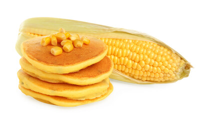 Stack of tasty corn pancakes with sweet kernels and cob isolated on white