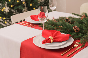 Beautiful table setting with Christmas decor indoors
