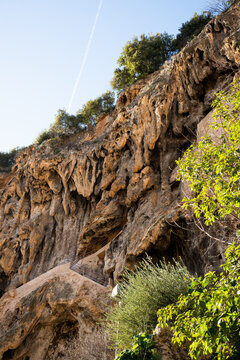 Detail of the cliff over Cotignac, a French village in Provence. It is famous for its tufa cliffs covered with large stalactites, and its two feudal towers from 1033.