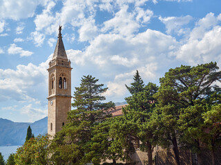 Fototapeta na wymiar Tower bell of the Church of St. Eustace (Sv. Eustahije). Saint Eustachius church in Dobrota. Kotor bay, Montenegro, Europe