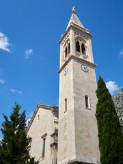 Fototapeta na wymiar Tower bell of the Church of St. Eustace (Sv. Eustahije). Church of St. Eustachius in Dobrota, Kotor bay, Montenegro, Europe