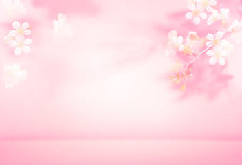 Spring summer blurred light pink background with shadow of the tree leaves and flowers on a wall. Abstract Spring Summer scene for product presentation.