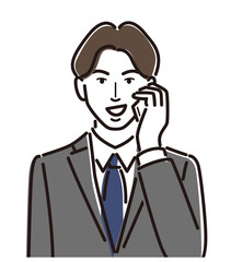 スマホで電話する　何かを企んでいるビジネスマン