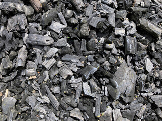 Black charcoal texture background. macro charcoal background,charcoal,BBQ grill coal top view. Black charcoal texture background
