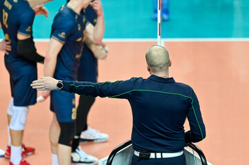 The referee gives a sign with his hand during a volleyball match
