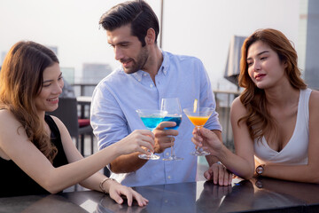 Group friends drinking cocktail and cheer in party at restaurant luxury for celebrate with enjoyment together, society of man and woman meeting and drinking beverages, lifestyles concept.