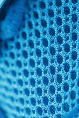 Macro Ventilation grid of blue sneakers in full screen