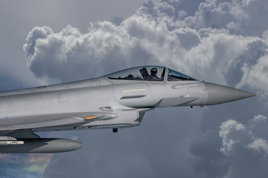 RAF Typhoon Fighter Jet in Flight. Action photograph of Fast Jet military aeroplane on a combat mission. Used against Houthi Rebels