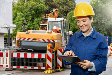 Woman construction worker with digital tablet on the site