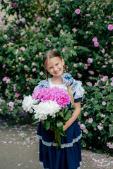 Fototapeta premium little girl with flowers