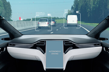 Self driving car on a road. Autonomous vehicle. Inside view.	