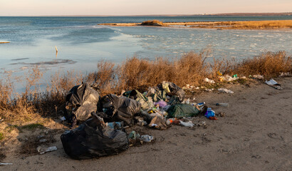Pollution with plastic and household waste of nature on the shore of the Tiligul estuary, Ukraine